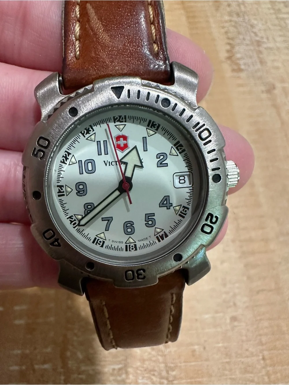Victorinox Silver Bezel Watch with White Dial and Brown Leather Strap
